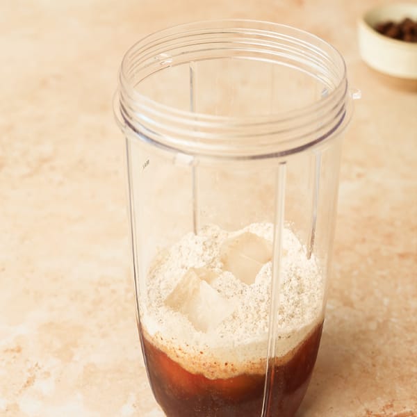 Blend the SHEKO powder coffee with the collagen powder and milk in a blender.